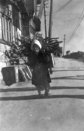 Woman Carrying Firewood